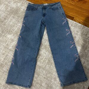 Gogo Jeans w/ pink bows down sides SZ 9/29